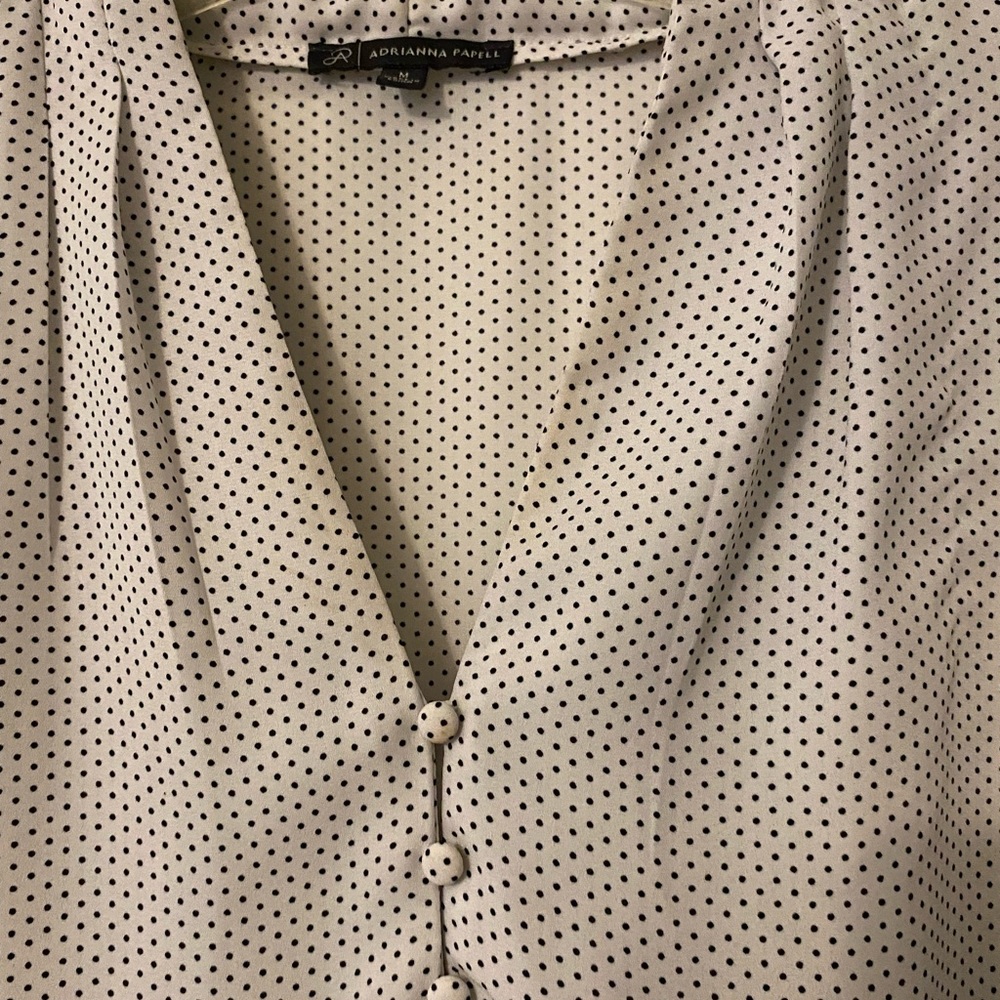 Black and white polka dot shirt.